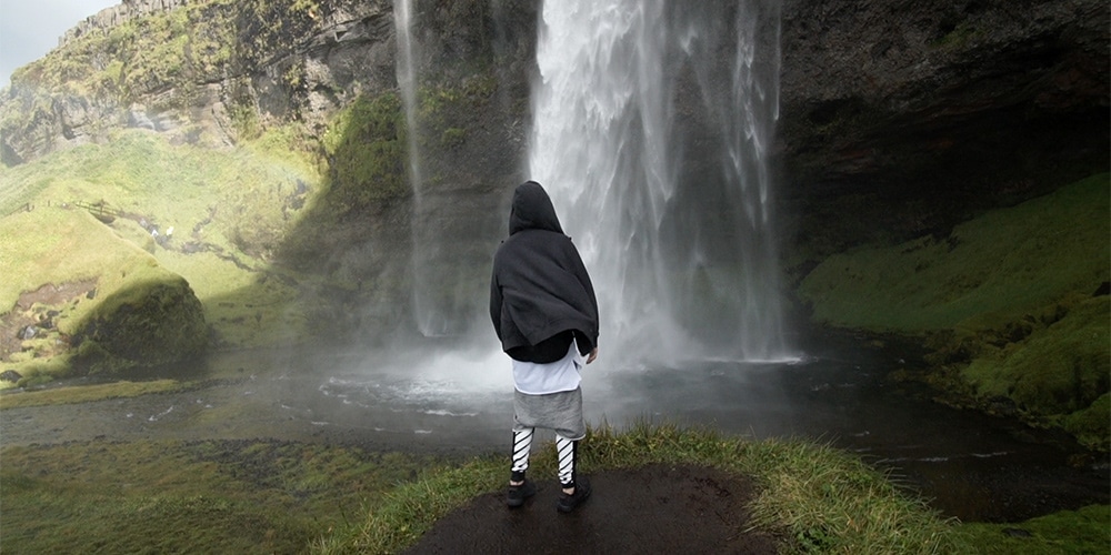 Justin Bieber checking out a waterfall in Iceland in the music video for "I'll Show You." (Photo: Rory Kramer)