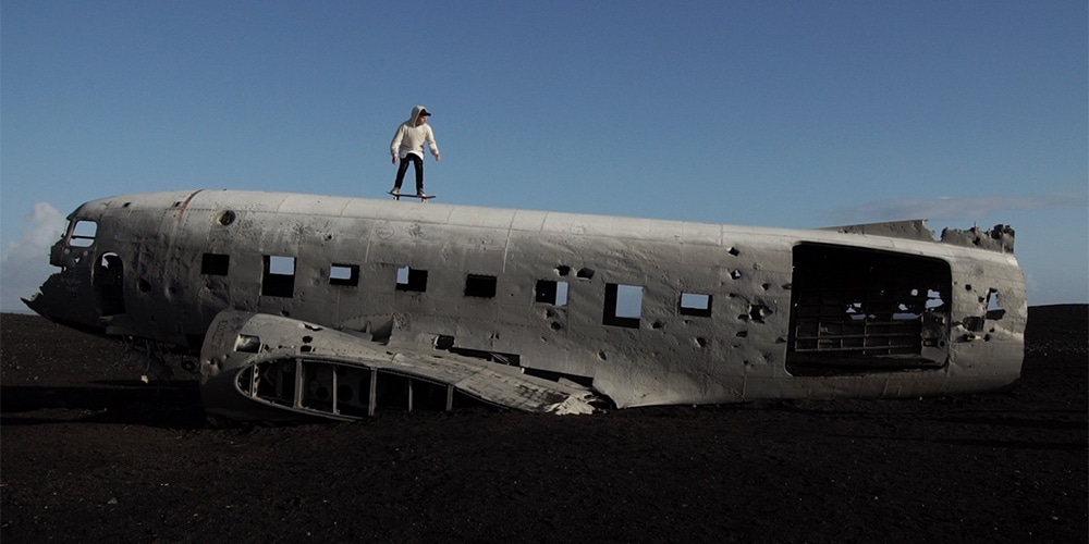 Justin Bieber skateboarding on top of an abandoned airplane in Iceland in "I'll Show You." (Photo: Rory Kramer)