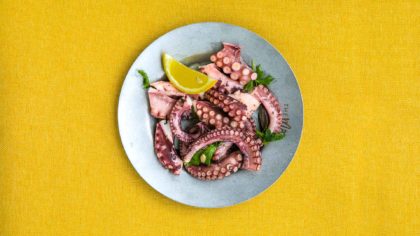 Grilled octopus with lemon and herbs.