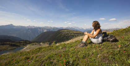 Woman sitting at overlook in Kootenay National Park