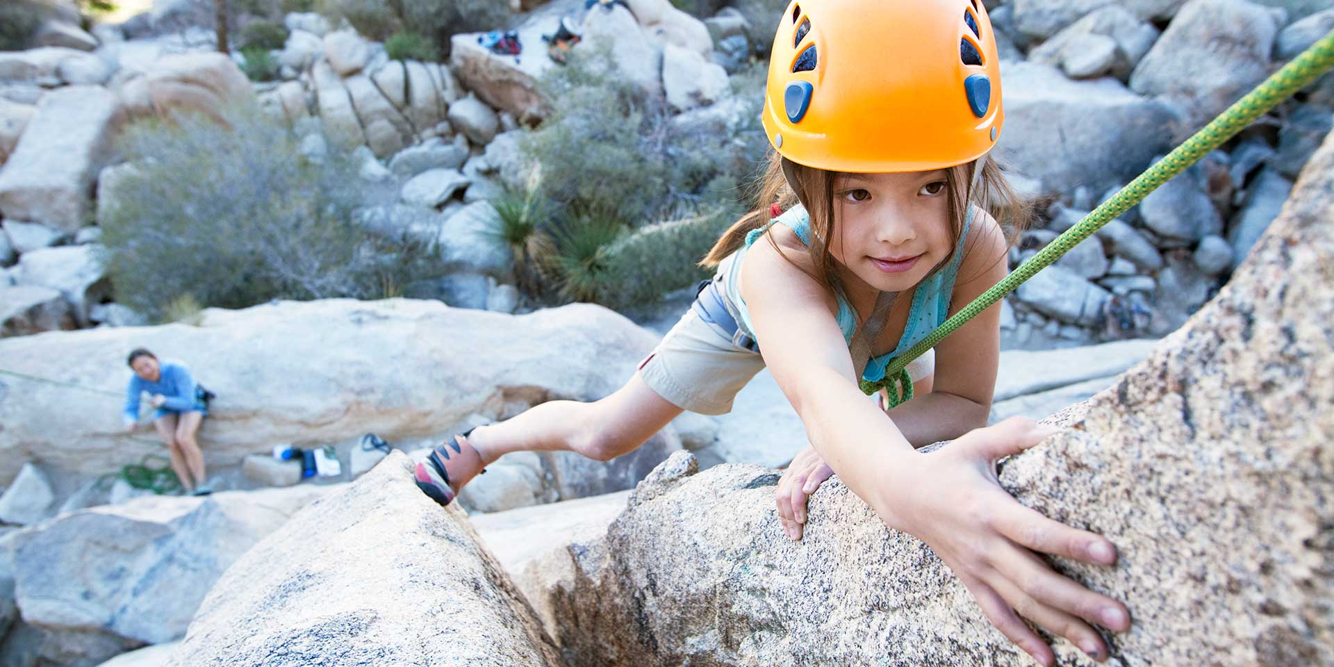 child rock climbing in Joshua Tree