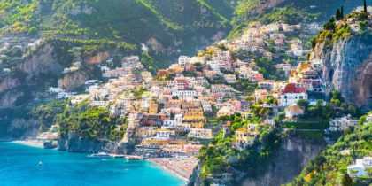 colorful buildings rising up steep incline in positano italy