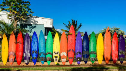 colorful surfboard fence in paia
