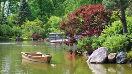 rowboat in water at japanese garden
