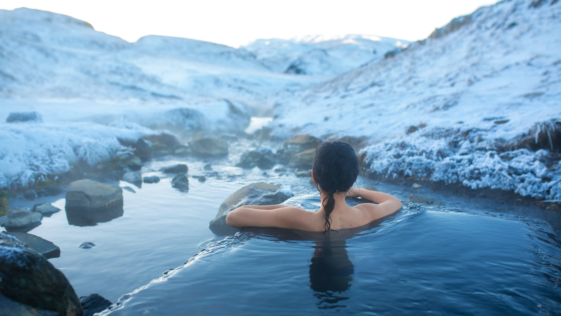 woman in natural pool in iceland
