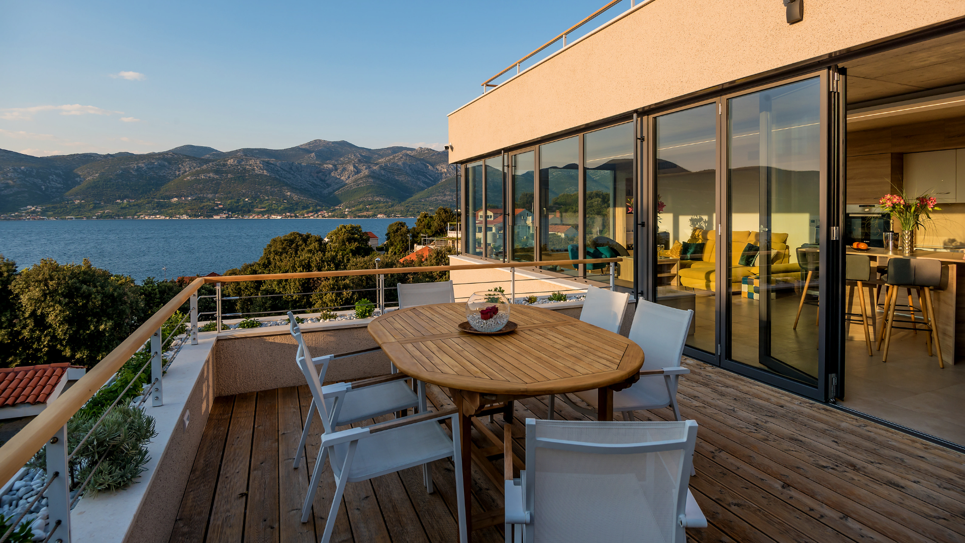 house with outdoor deck overlooking water in Korčula Island, Croatia