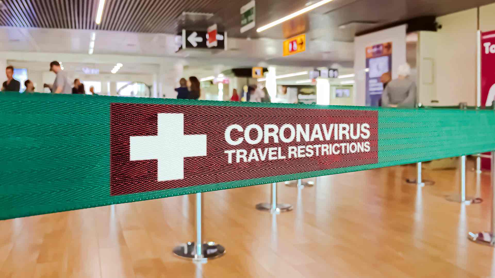 coronavirus travel restrictions sign at airport