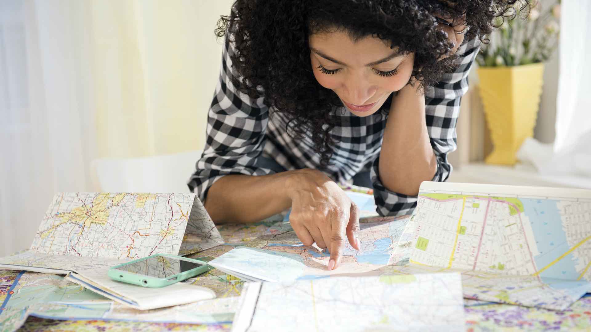 woman reading maps