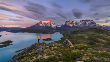 hiker looks toward mountains in Torres del Paine National Park