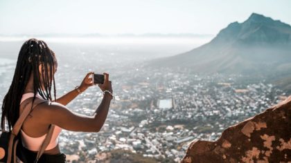 woman snapping photo from above
