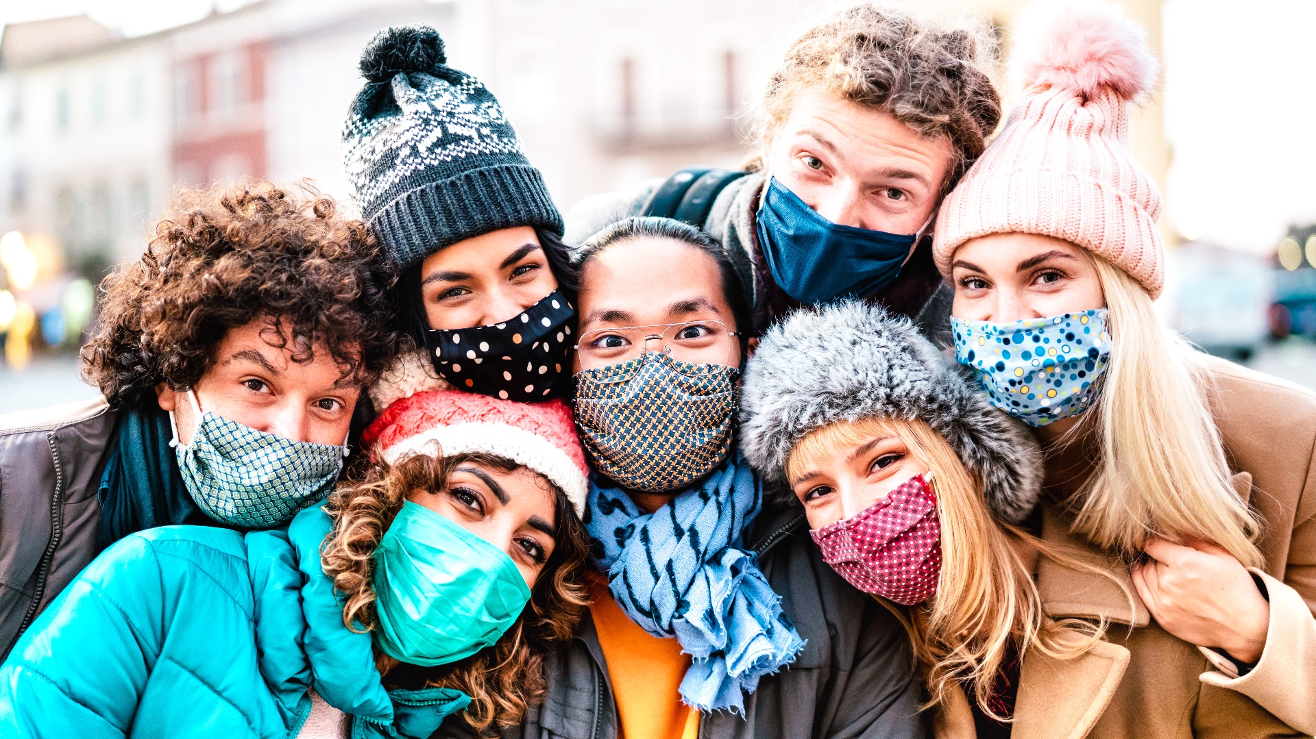group of friends in masks in winter