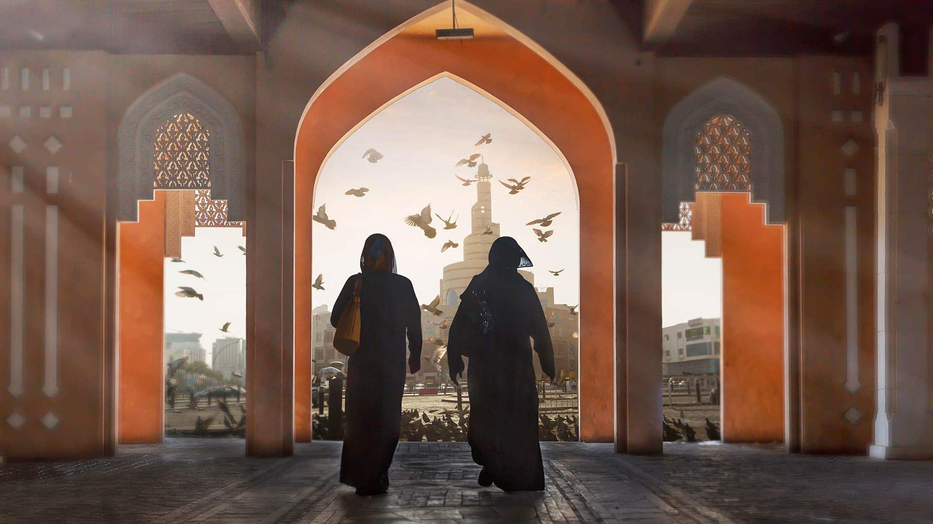 women walking through entryway in qatar