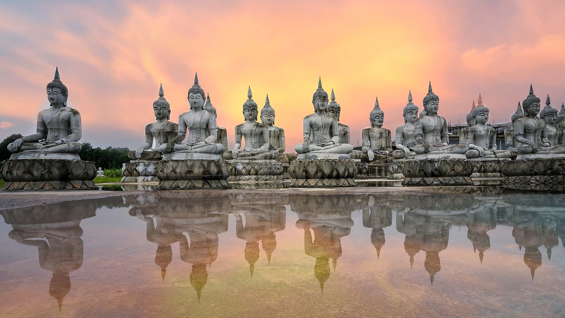 buddha statues in thailand at dusk