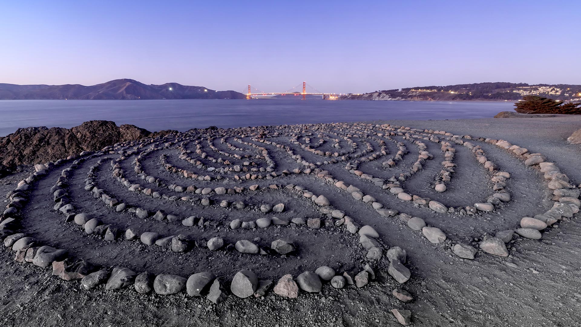 land's end labyrinth at dusk by water