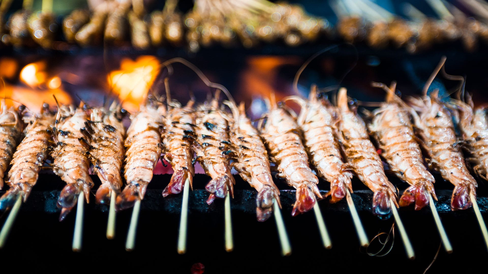 street food prawns on grill in singapore