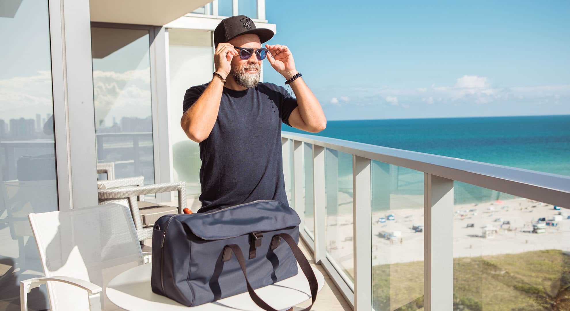 Chef Cesar Zapata on balcony overlooking beach