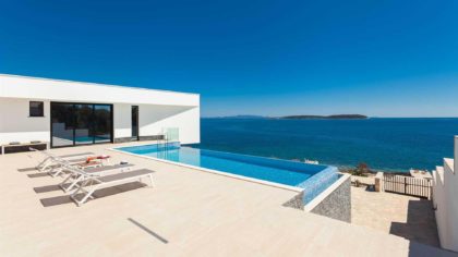 Deck overlooking beach with private infinity pool in Croatia.