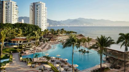 Pool and beach at the Marriott Puerto Vallarta Resort & Spa with mountains in distance