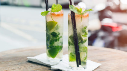 Two cold mojitos with straws