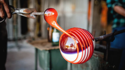 Glass blowers making a sphere