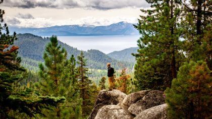Hiker on rocks in Lake Tahoe