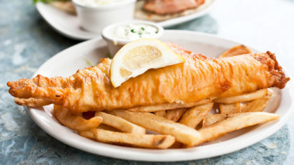 Fish and chips with lemon on plate