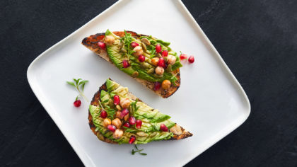 Avocado toast with pomegranate seeds and chick peas