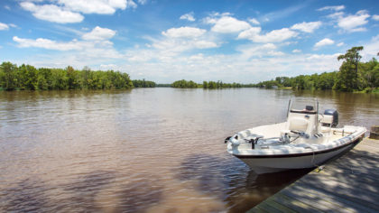 Boat on Calcasieu River in Louisiana on sunny day