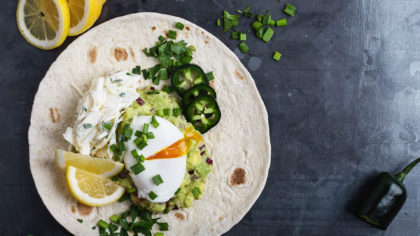 Egg and guacamole over flour tortilla