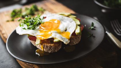 Breakfast toast with fried egg and avocado
