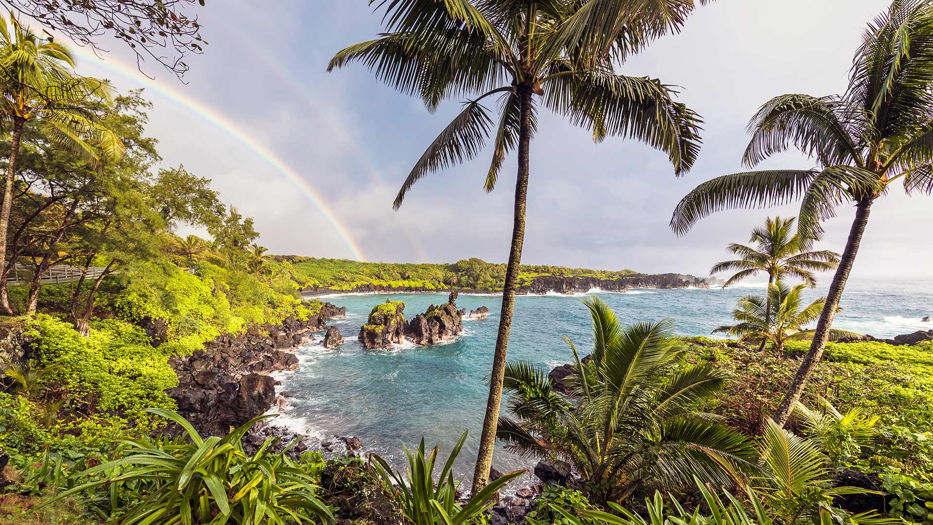 Double rainbow over Maui coastline