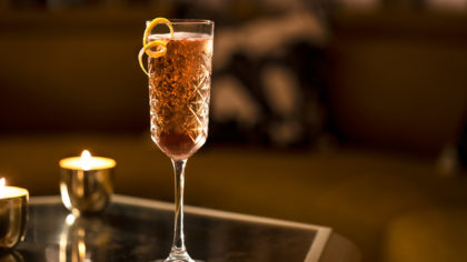 Champagne cocktail with orange twist