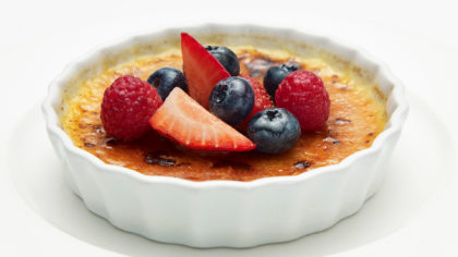 creme brûlée with strawberries and blueberries