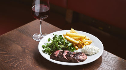 Steak and fries with red wine