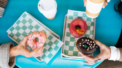 People eating donuts and coffee