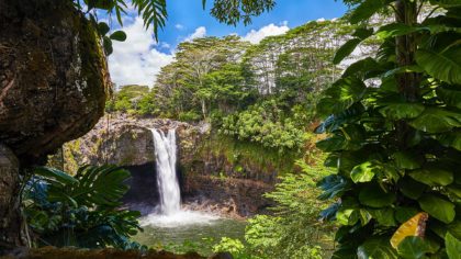 Rainbow Falls in Hawaii State Park on a sunny day