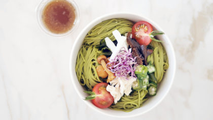 Green ramen noodle bowl with fresh veggies