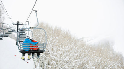 Couple on ski lift in Utah