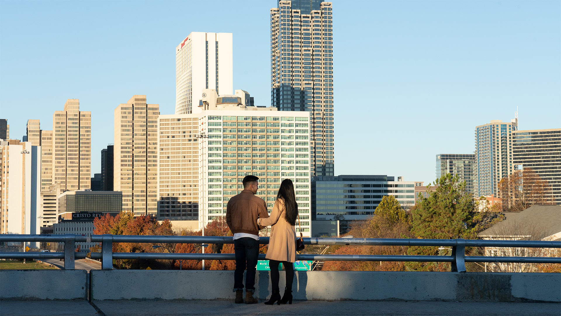 Couple looking out at Atlanta skyline