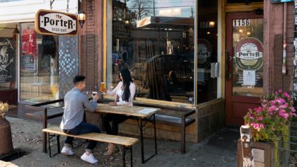 couple sitting outside Porter Beer Bar