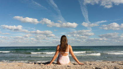 Woman sitting on the beach in Fort Lauderdale