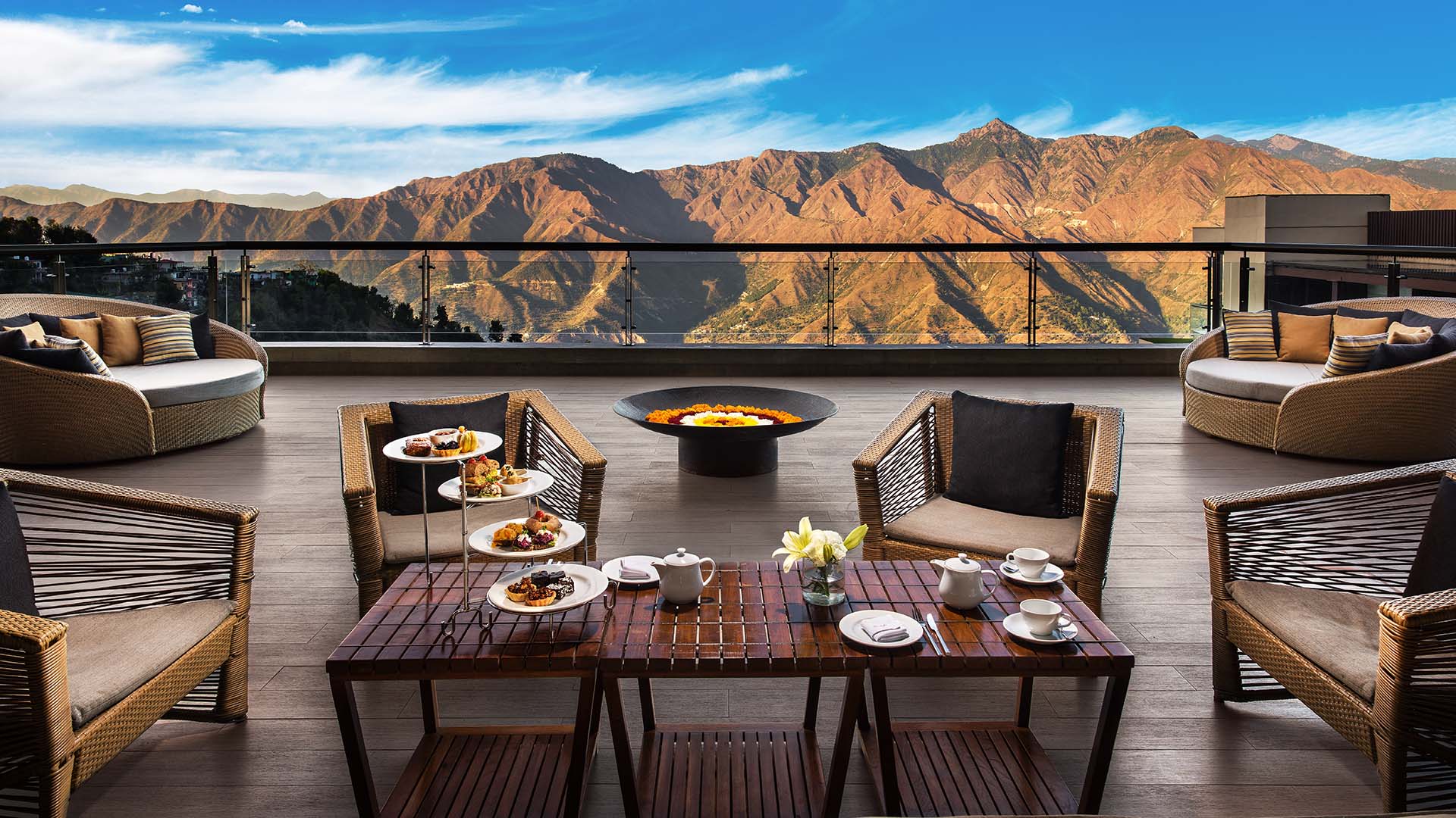 jw mussoorie outdoor deck with tables and firepit