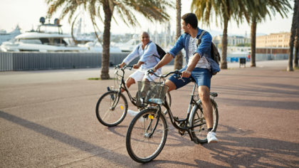 two men on bicycles in barcelona