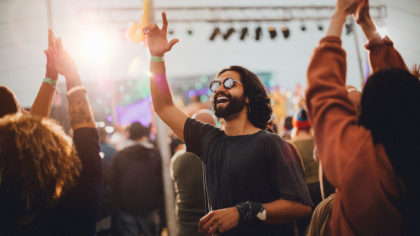 bearded man in sunglasses at music festival