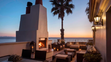 A hotel patio with a fireplace