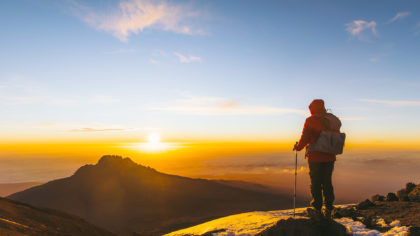person on summit of mount kilimanjaro