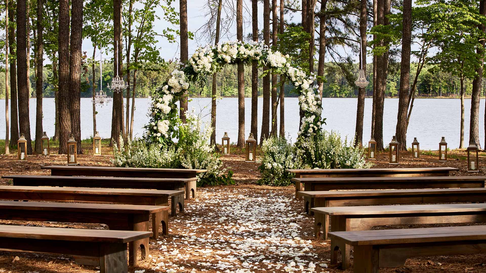 A rustic wedding ceremony set up near the lake