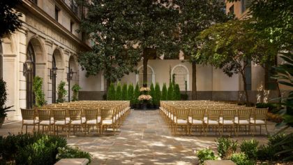 A courtyard set up for a wedding ceremony