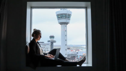 a girl sitting in a hotel near the airport