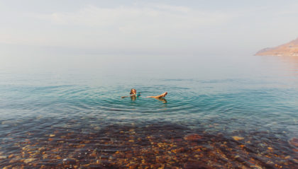 a woman floating in the dead sea
